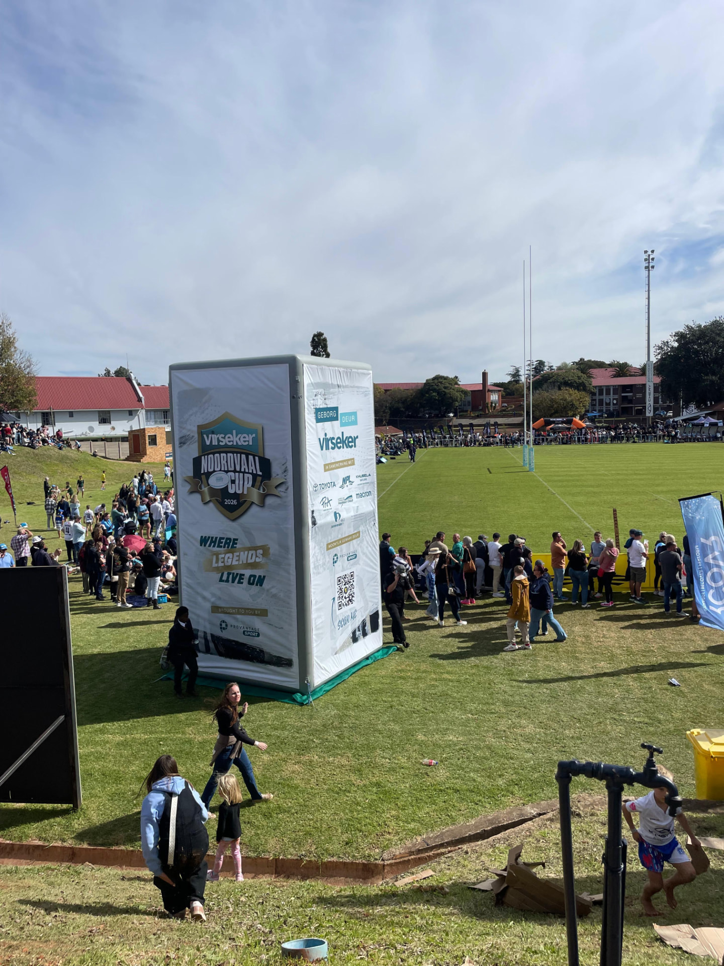 Inflatable Noordvaal Cup tower in front of a rugby crowd