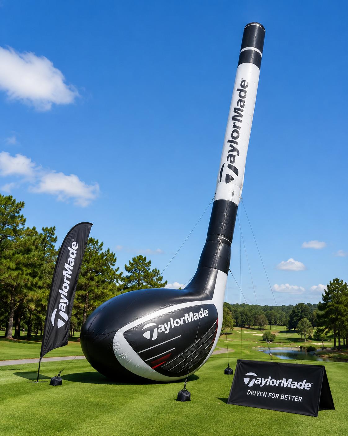 Giant inflatable TaylorMade driver standing on a golf course